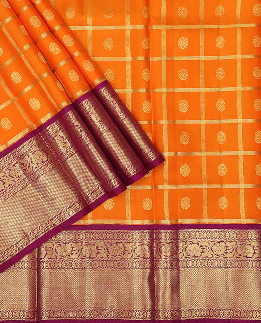Orange pure-silk half saree, chakram butta enclosed checked skirt, contrast border & blouse of banaras,mayil kann & kodi visiry & intricate dhavani
