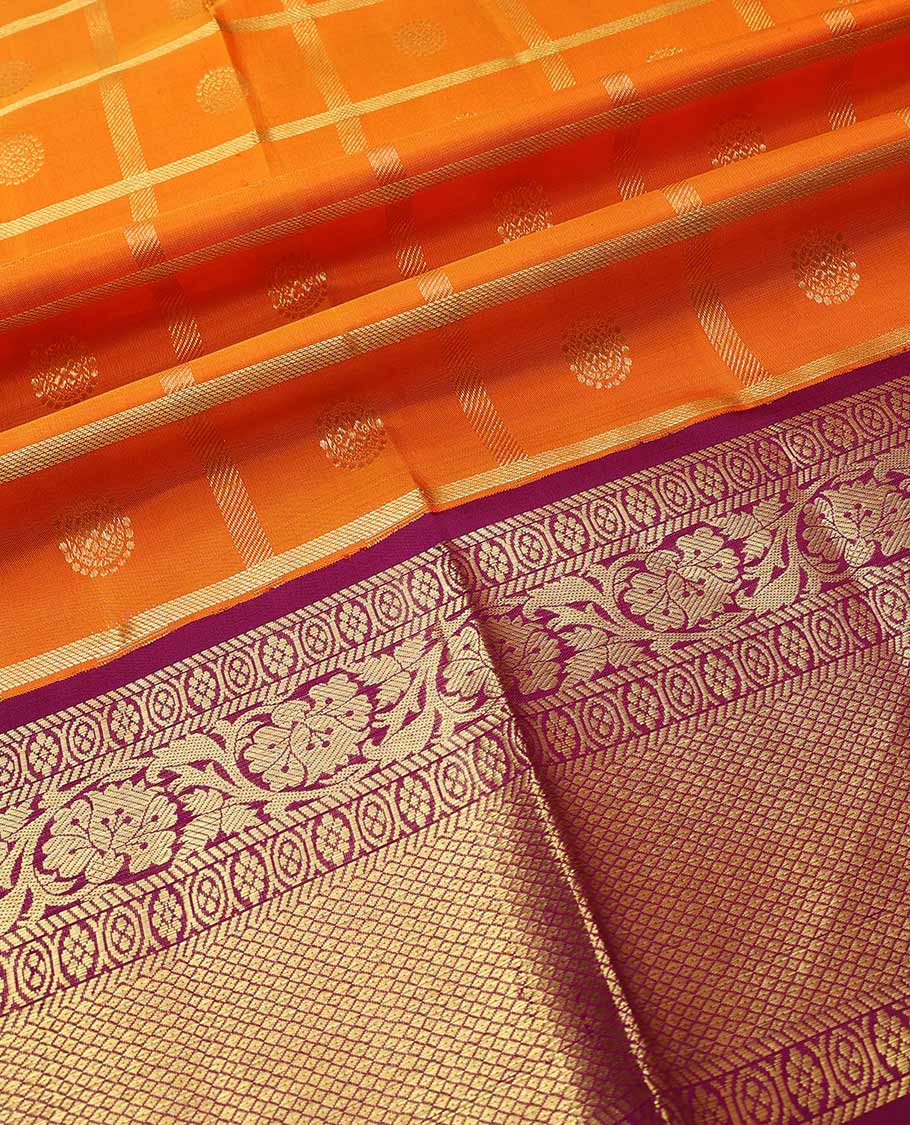 Orange pure-silk half saree, chakram butta enclosed checked skirt, contrast border & blouse of banaras,mayil kann & kodi visiry & intricate dhavani