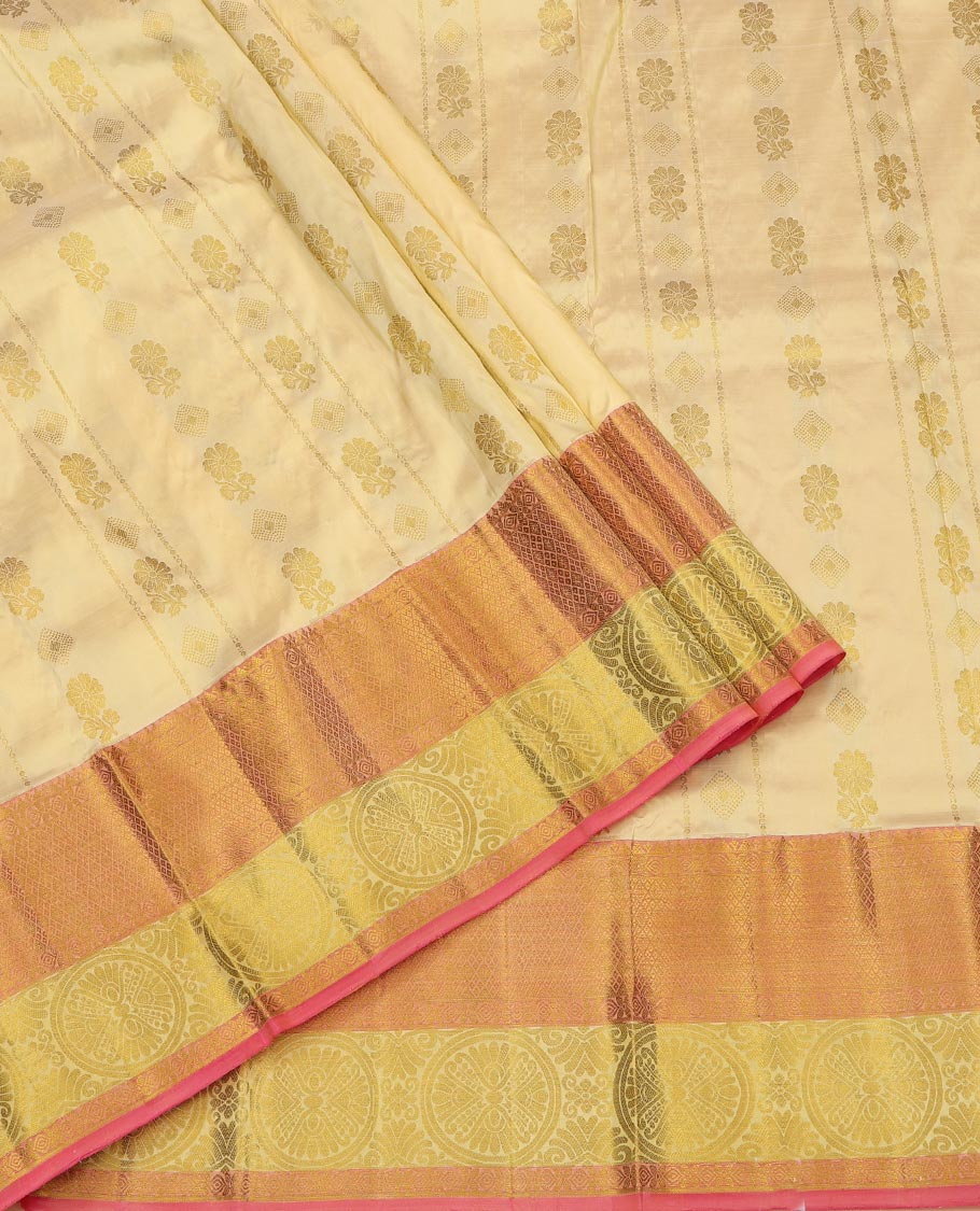 Gold Pure Silk Half-Saree, Spotlighted with Zari Buttas All Over Its Skirt, Complemented by Contrast Border of Jaal and Chakram Designs, Paired with a Contrast Blouse, and Comes with a Floral Design Dhavani