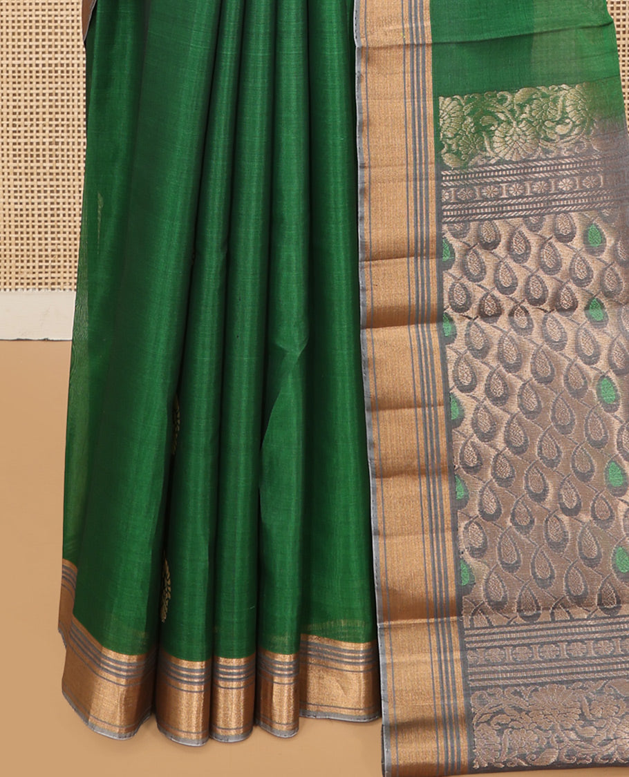 Green Cotton Saree, Highlighted by Zari Buttas, a Contrast Zari Border, an Intricate Pallu and a Contrast Blouse