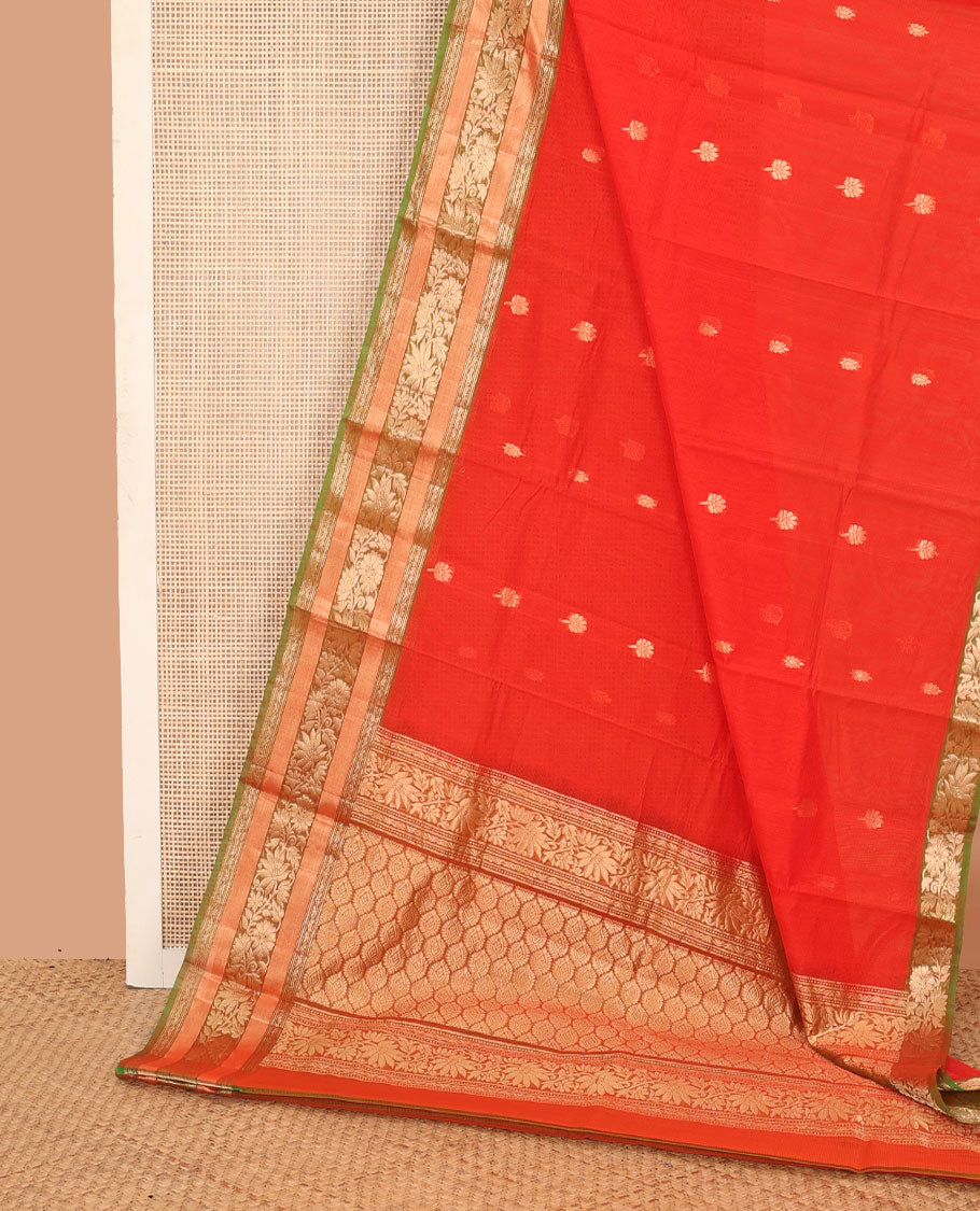Orange zari buttas silk cotton saree, contrast traditional zari border of floral creeper design, and ogee patterned pallu