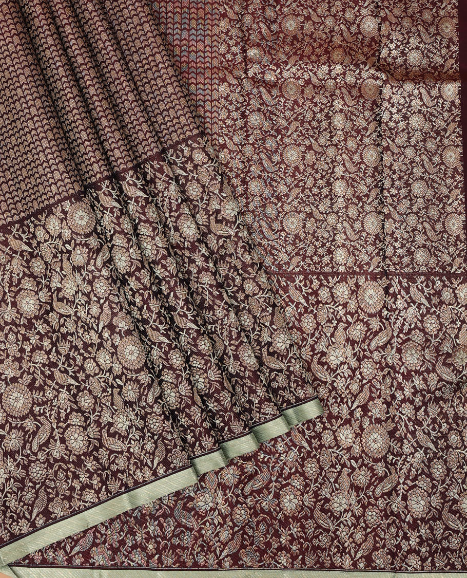 Maroon jacquard silk saree, big zari border & pallu accentuated with floral & bird jaal jacquard zari design