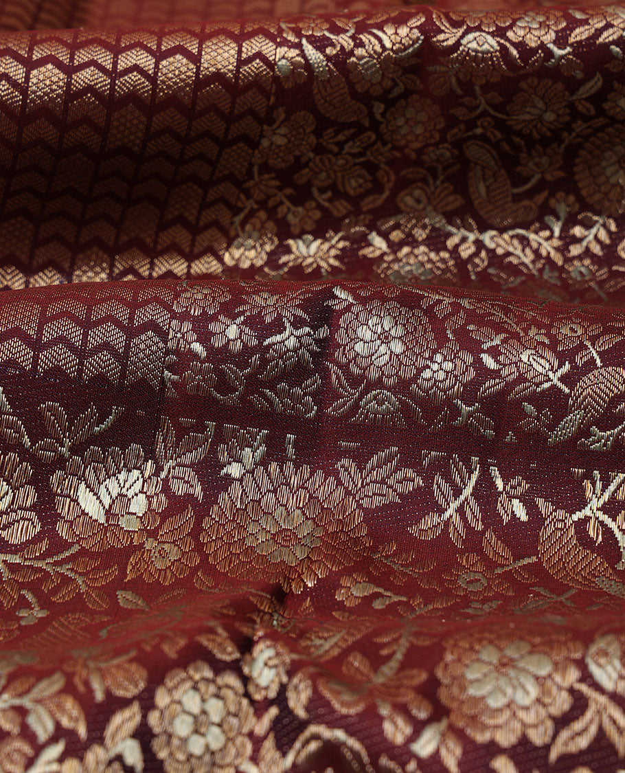 Maroon jacquard silk saree, big zari border & pallu accentuated with floral & bird jaal jacquard zari design
