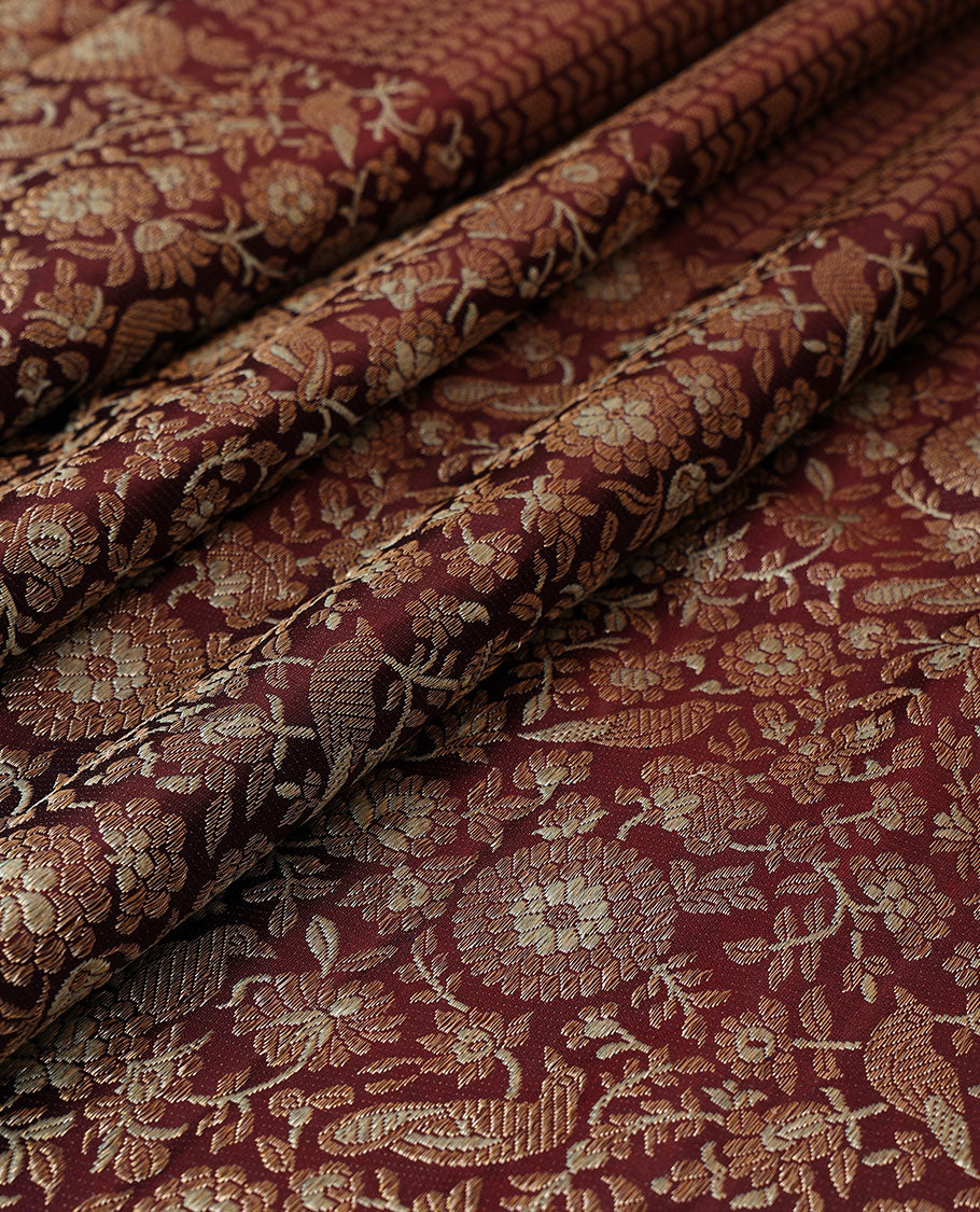 Maroon jacquard silk saree, big zari border & pallu accentuated with floral & bird jaal jacquard zari design