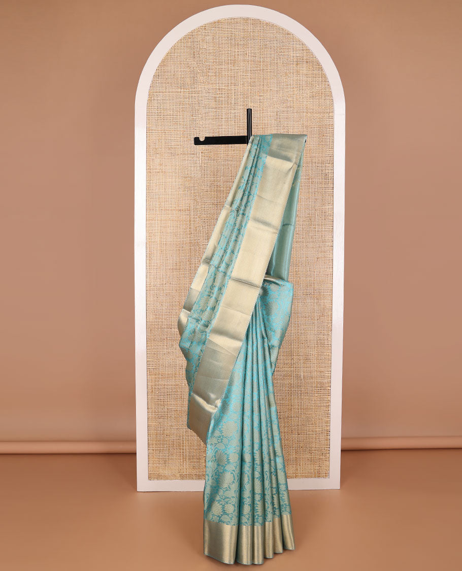 Blue floral jacquard tissue saree with contrast striped border & zari design pallu