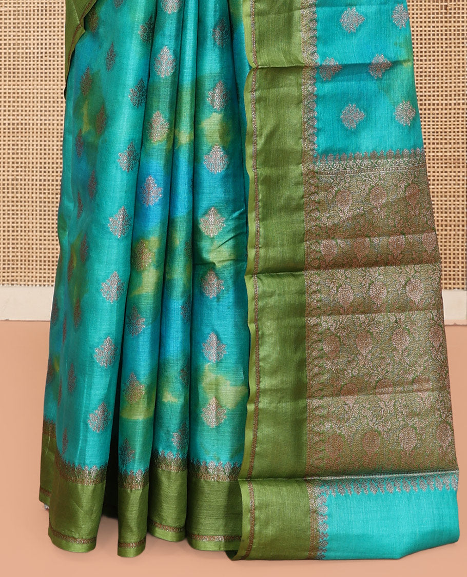 Blue Tussar Silk Saree Features Buttas, Complemented by a Contrast Traditional Zari Border, Intricately Designed Pallu, and a Contrast Blouse