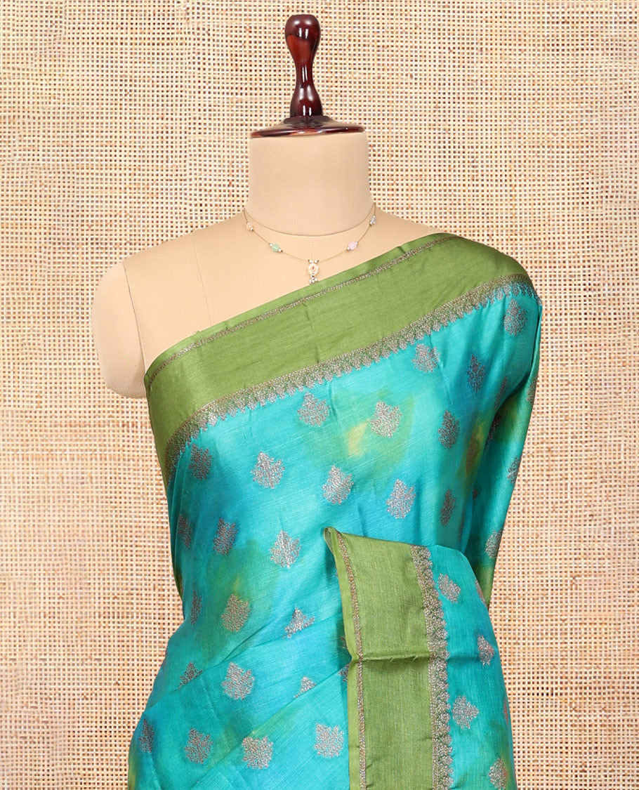 Blue Tussar Silk Saree Features Buttas, Complemented by a Contrast Traditional Zari Border, Intricately Designed Pallu, and a Contrast Blouse