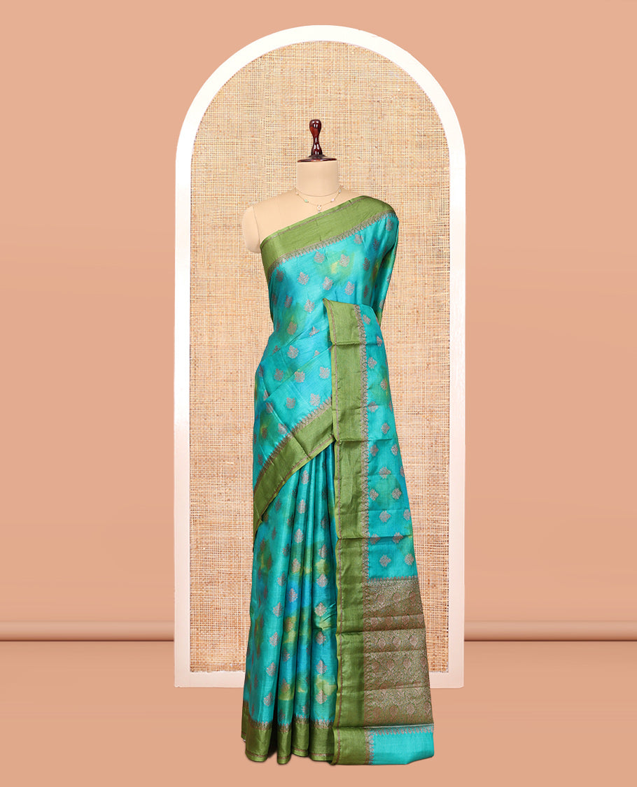 Blue Tussar Silk Saree Features Buttas, Complemented by a Contrast Traditional Zari Border, Intricately Designed Pallu, and a Contrast Blouse