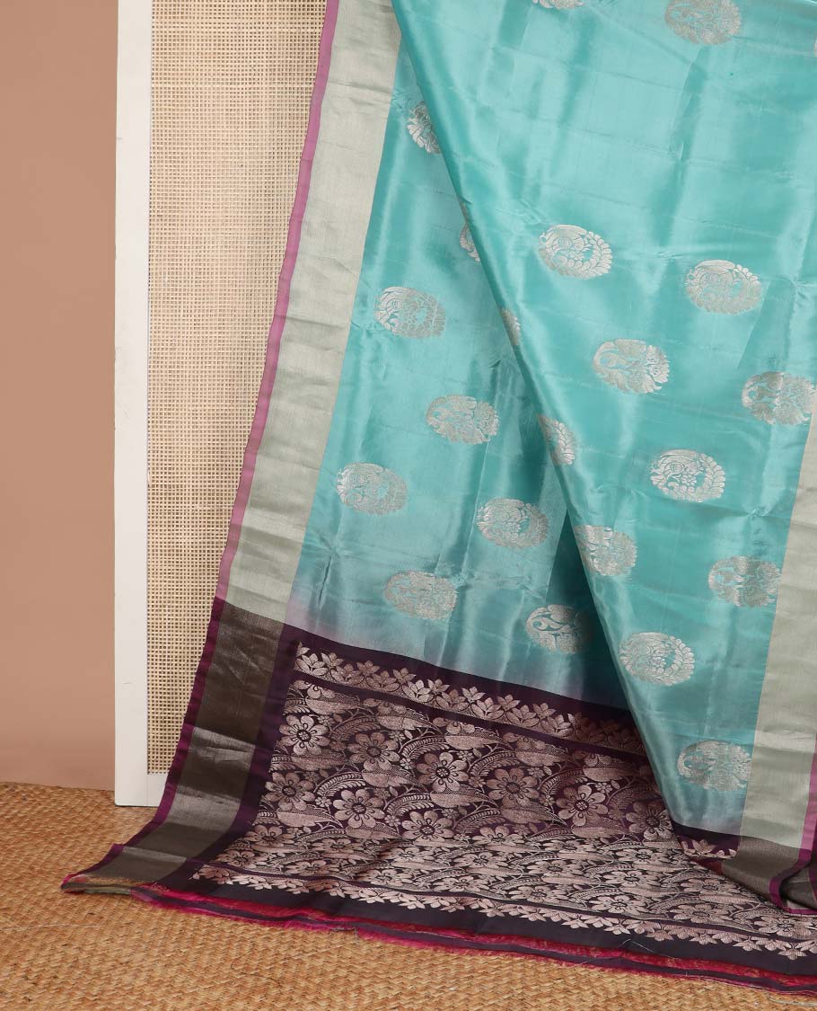 Light blue floral motifs uppada silk saree with contrast zari border & floral design pallu