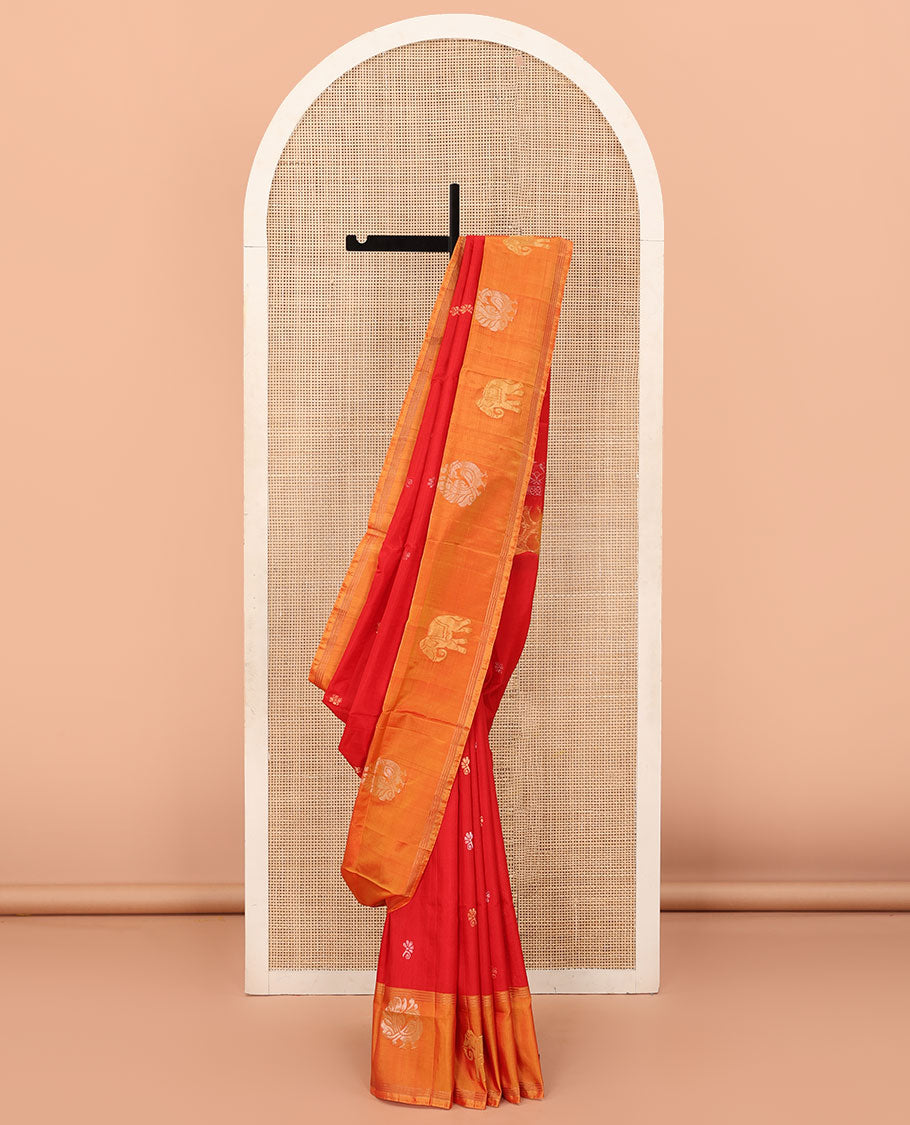 Red Uppada Silk Saree Decorated with Zari Buttas, Captivating Contrast Border Featuring Peacock and Elephant Motifs in Zari, Pallu Adorned with Paisley Butta, Enclosed Jaal Design, and Paired with a Contrast Blouse