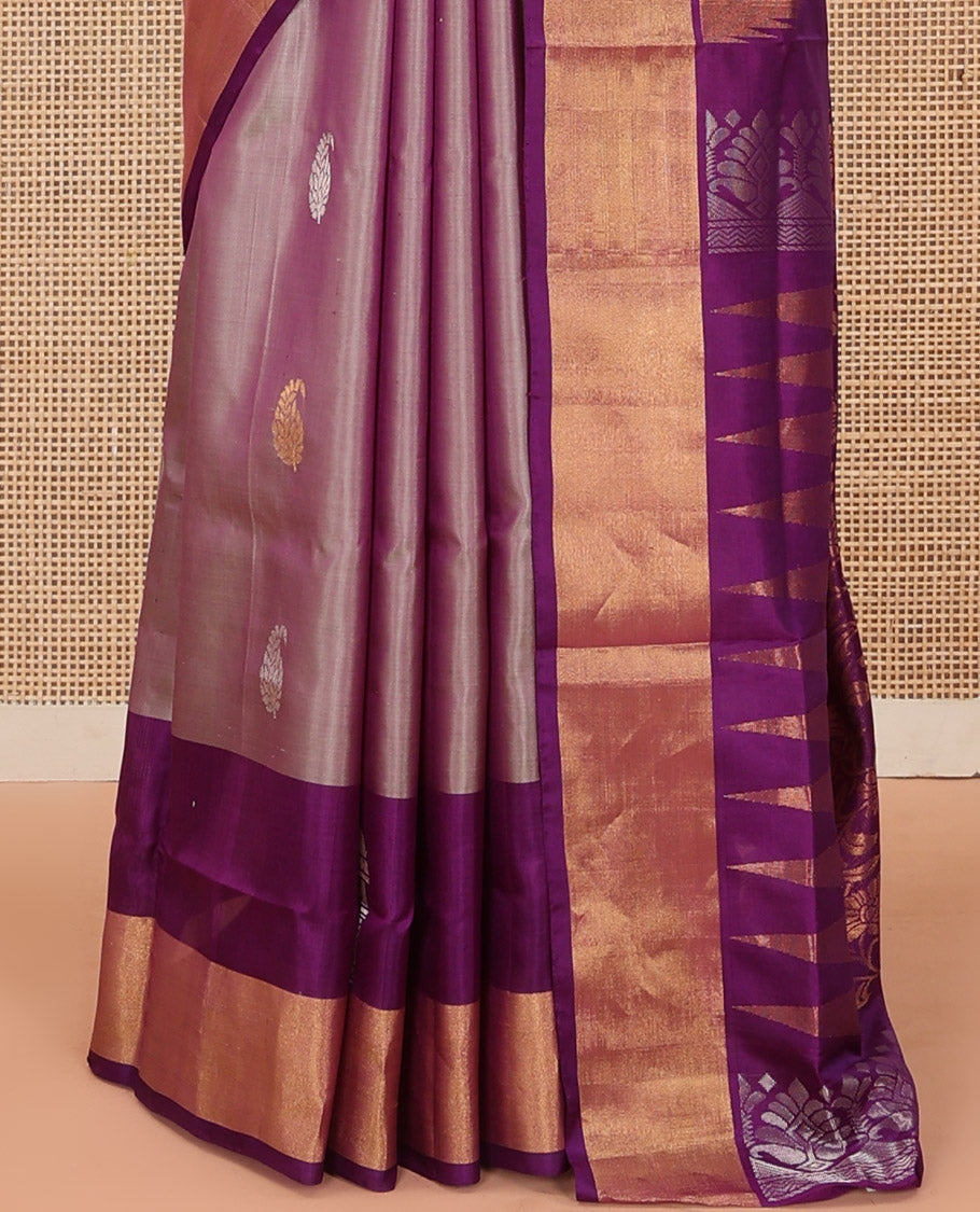Pink Uppada Silk Saree Spotlighted with Paisley Buttas All Over Its Body, Complemented by Contrast Border of Temple and Chariot Designs, Grandly Woven Pallu of Temple Floral Vine Designs, and Paired with a Contrast Blouse