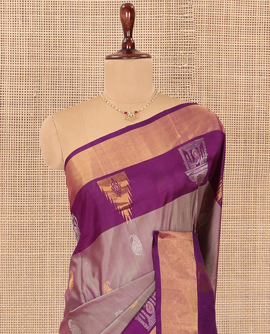 Pink Uppada Silk Saree Spotlighted with Paisley Buttas All Over Its Body, Complemented by Contrast Border of Temple and Chariot Designs, Grandly Woven Pallu of Temple Floral Vine Designs, and Paired with a Contrast Blouse