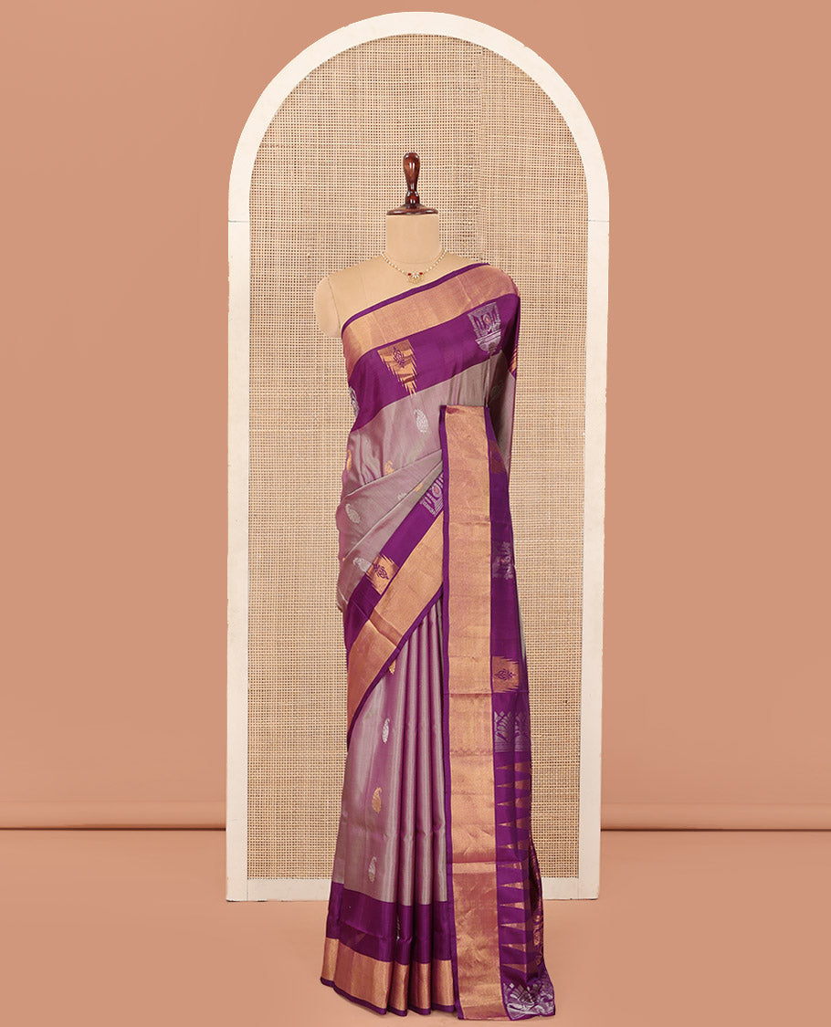 Pink Uppada Silk Saree Spotlighted with Paisley Buttas All Over Its Body, Complemented by Contrast Border of Temple and Chariot Designs, Grandly Woven Pallu of Temple Floral Vine Designs, and Paired with a Contrast Blouse