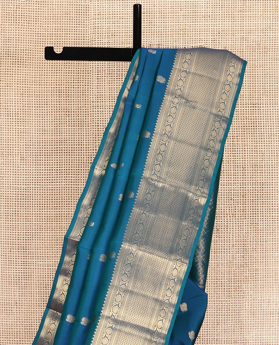 Blue Vasundhara Lite Silk Mix Saree, Graced with Zari Buttas All Over Its Body, Highlighted by a Zari Border of Rekku, Muthu, Kathir, Kodi Visiry, and Jaal Designs, Grand Jaal Pallu, and Paired with a Matching Blouse