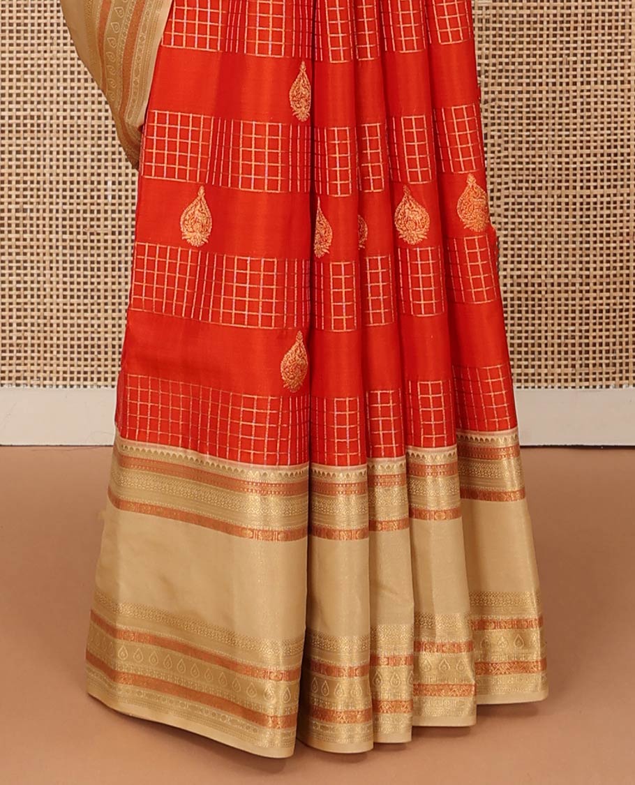 Orange zari checks and buttas Vasundhara silk mix saree, contrast rettai pettu border of thilakam mokku, muthu, cross neli, poun, ara madaam, and mayil designs, and then kuli kann pallu