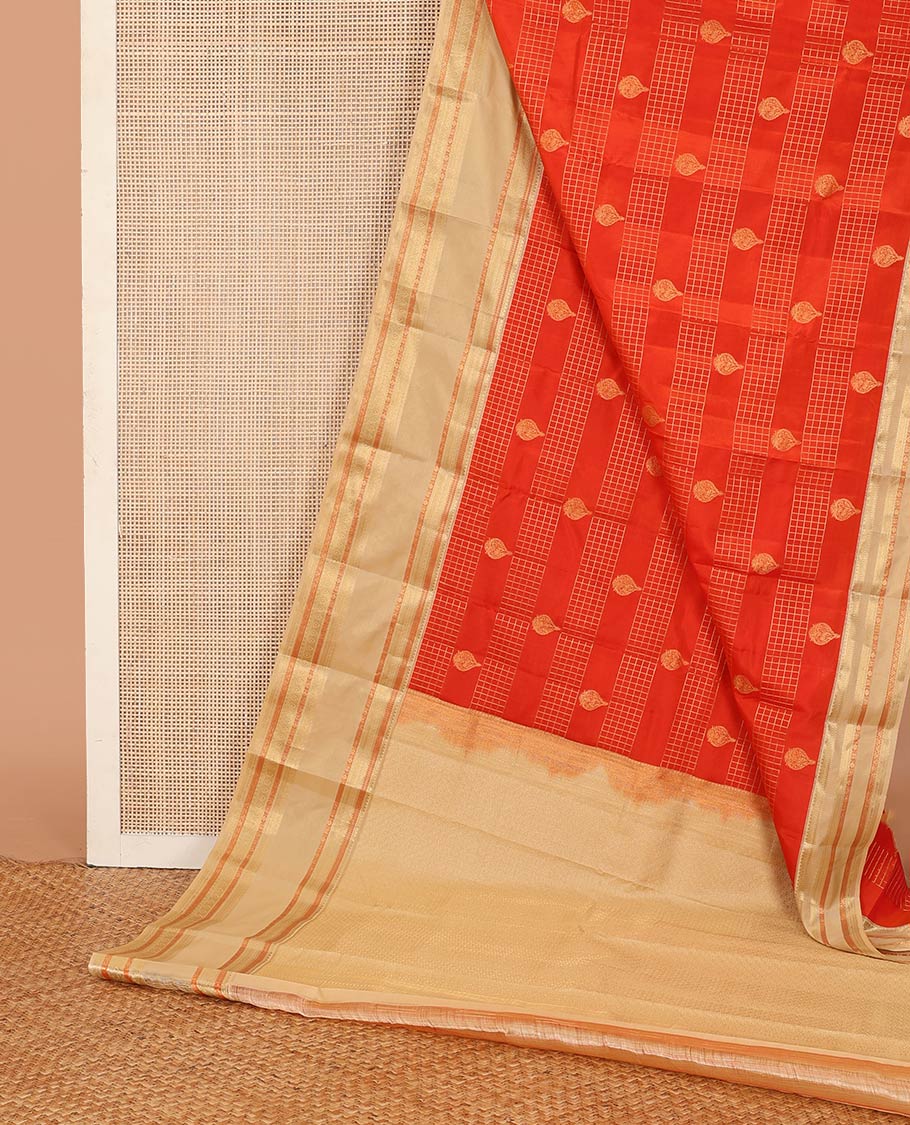 Orange zari checks and buttas Vasundhara silk mix saree, contrast rettai pettu border of thilakam mokku, muthu, cross neli, poun, ara madaam, and mayil designs, and then kuli kann pallu