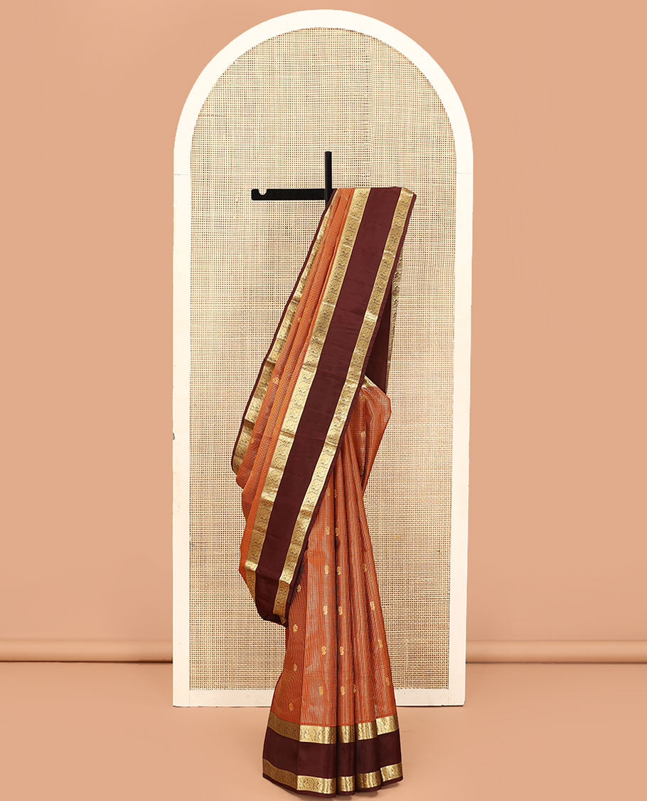 Orange Vasundhara Lite Silk Mix Saree, Embellished with Zari Butta Enclosed Checks on Its Body, Complemented by a Contrast Rettai Pettu Border of Mayil Designs, Pallu Steeped with Peaock Feather-Like Designs, and Paired with a Contrast Blouse