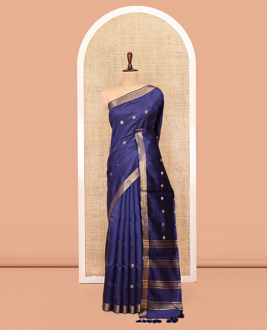 Blue Banana Pith Saree, Subtly Adorned with Buttas All Over Its Body, Highlighted by a Zari Bavanji Border, Gleaming Zari Striped Pallu, and Paired with a Matching Blouse
