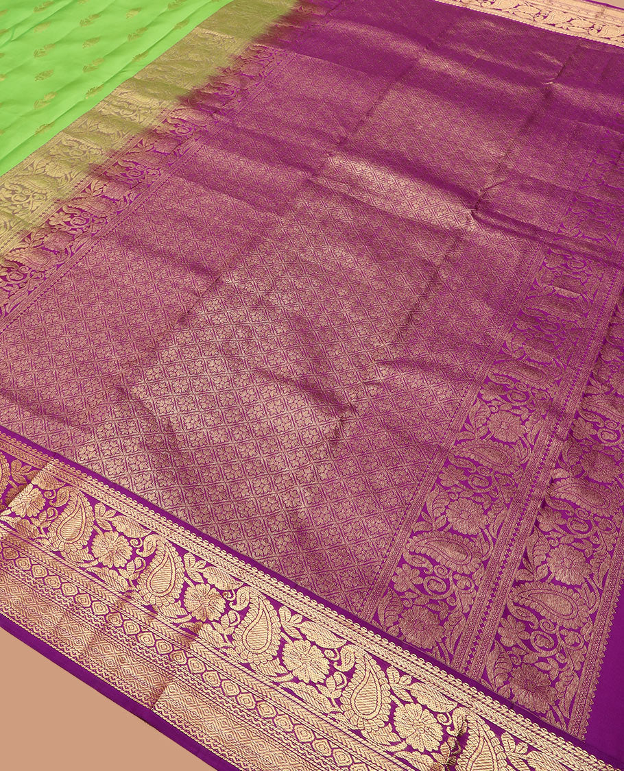 Parrot green zari buttas silk saree, contrast border of thilakam mokku, kathir, floral, manga, thilakam, neli, and diamond designs, and jaal pallu