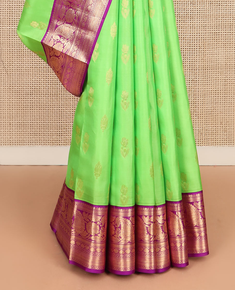 Parrot green zari buttas silk saree, contrast border of thilakam mokku, kathir, floral, manga, thilakam, neli, and diamond designs, and jaal pallu