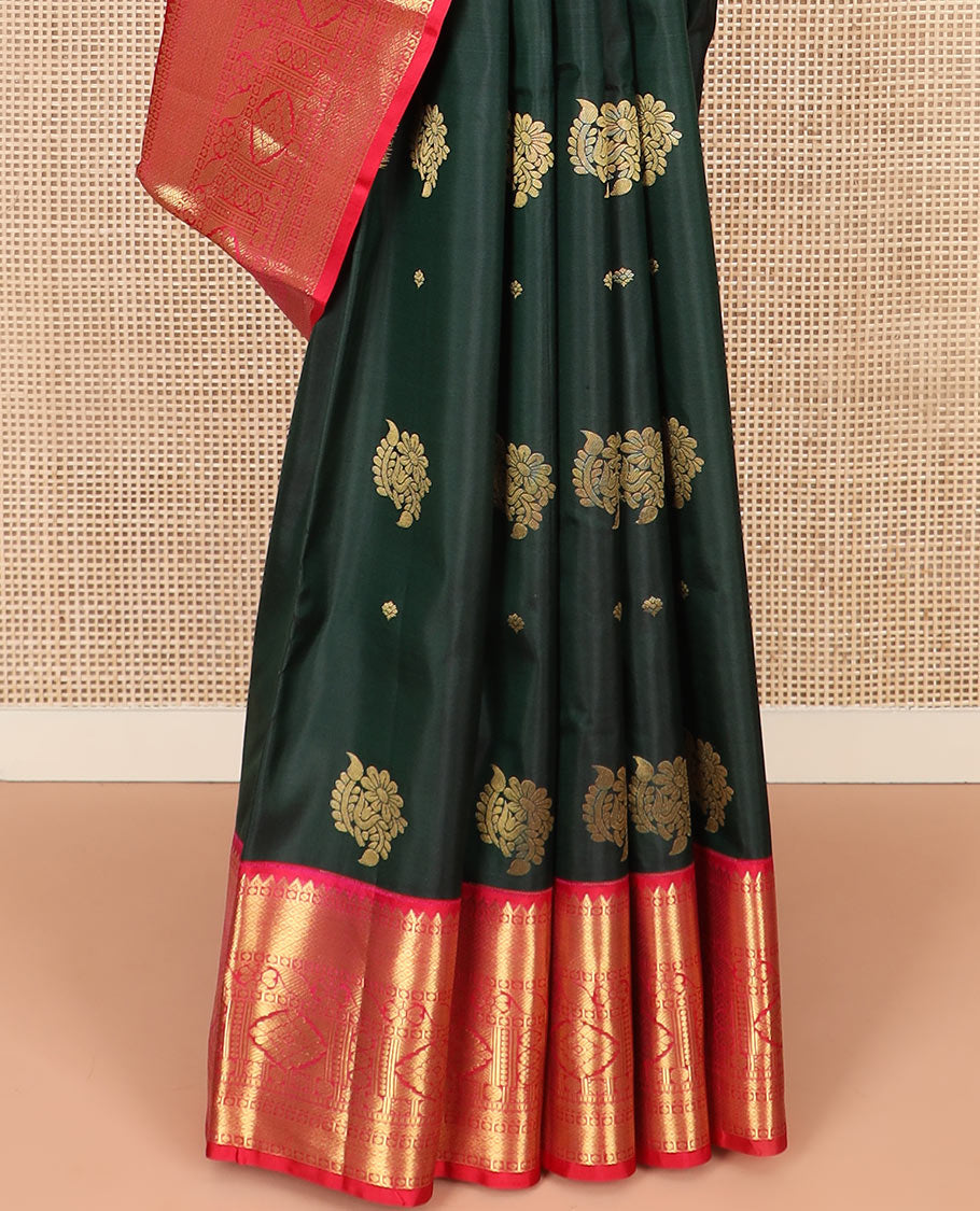 Green Vasundhara Silk Saree Decorated with Zari Buttas, Complemented by a Contrast Border of Rekku, Mayil Kann, Cross Kamalam, Laddu Kamalam, Rudraksham, Rettai Neli, Muthu, and Mayil Kann, Grandly Woven Jaal Pallu, and Paired with a Contrast Blouse