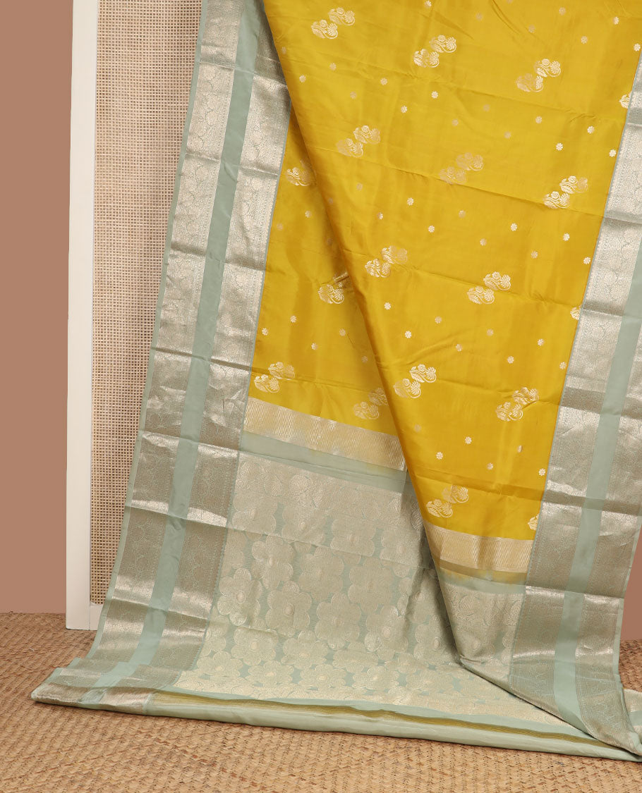 Yellow zari buttas silk saree, contrast rettai pettu border of thilakam,manga,banaras,poun & kodi visiry & floral design pallu