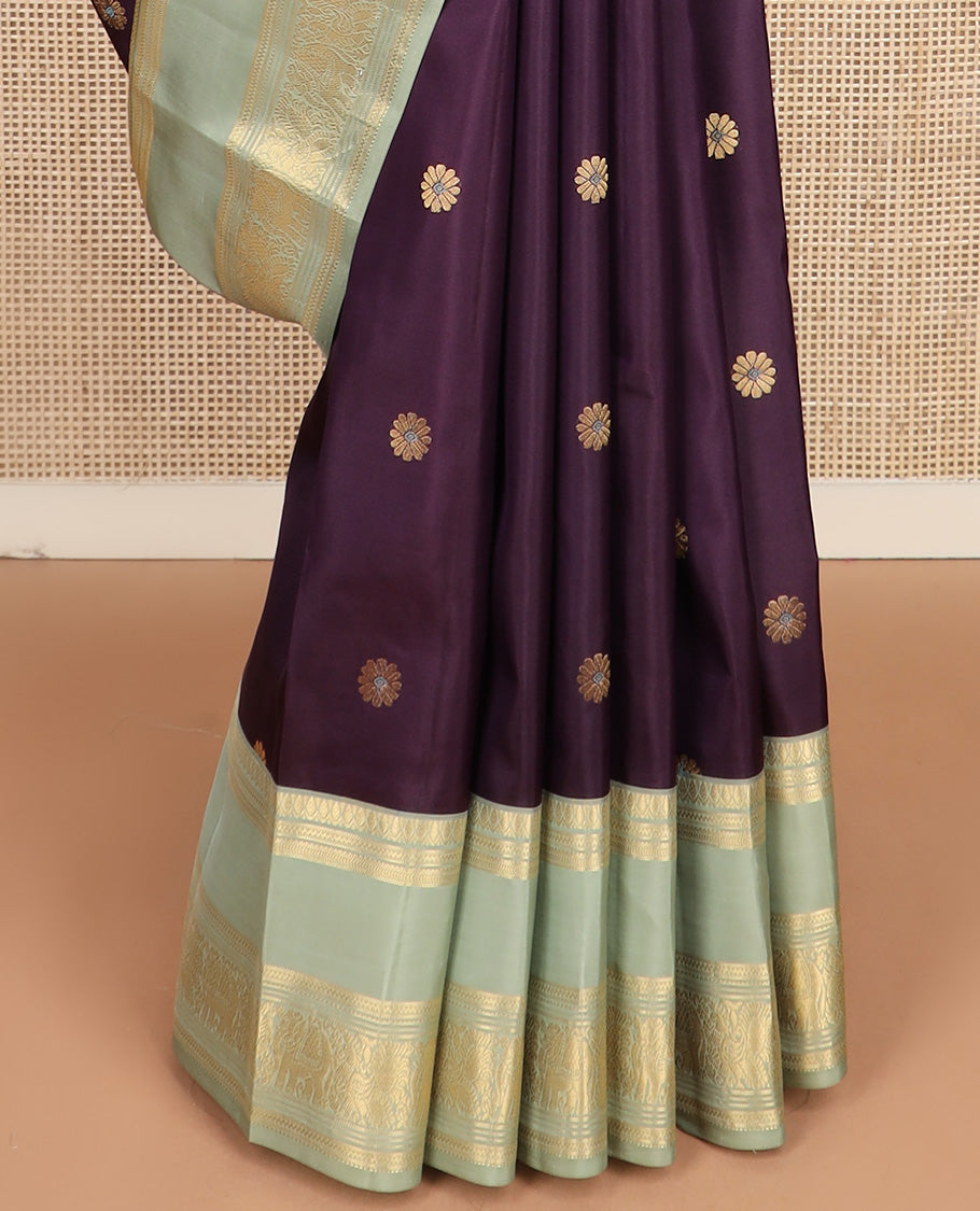 Purple meenakari kamalam buttas silk saree, contrast rettai pettu border of thilakam, neli, kathir, mayil, and yanaai designs, and intricate pallu
