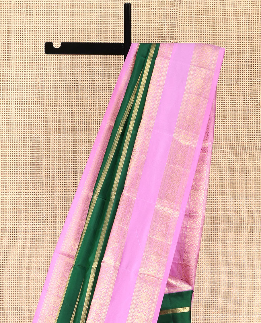 Green Vasundhara Silk Saree, Gracefully Embellished with Zari Stripes All Over Its Body, Complemented by Contrast Rettai Pettu Traditional Zari Design Border, Intricately Designed Pallu, and Paired with a Contrast Blouse