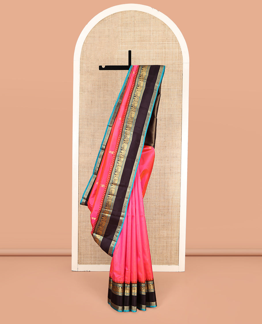 Pink Vasundhara Silk Saree, Embellished with Zari Buttas, Complemented by Contrast Rettai Pettu Temple Border, Grand Paiyadi Kattam Pallu, and a Contrast Blouse