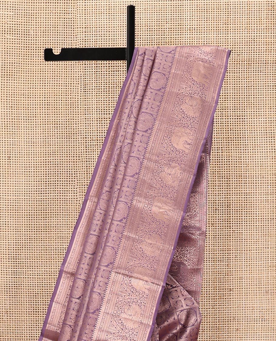 Purple Kanchipuram Wedding Silk Saree, Beautifully Bedecked with Mayil-Chakram Jacquard on Its Body, Highlighted by a Zari Border of Thilakam Mokku, Kodi Visiry, Annam, and Yaanai Designs, Intricately Designed Pallu, and Paired with a Matching Blouse