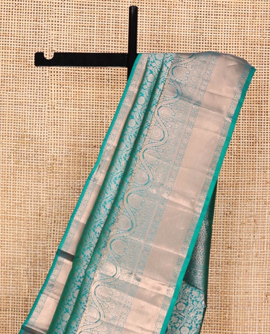 Blue Kanchipuram Wedding Silk Saree, Enriched with Jacquard Design on Its Body, Highlighted by Zari Border of Thilakam Mokku, Mayil Kann, Kathir, and Dhavana Kodi Designs, Grand Pallu, and Paired with a Matching Blouse