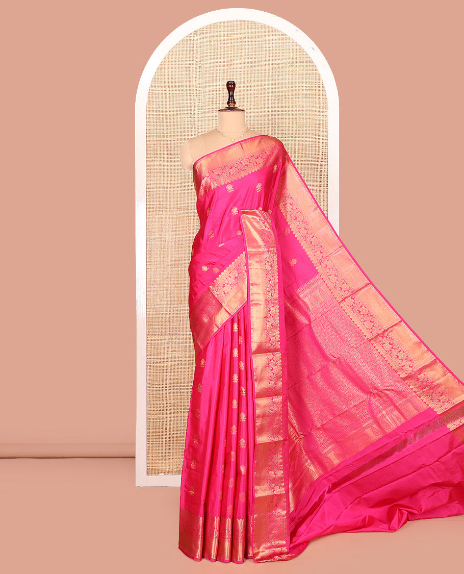 Pink Budget Silk Saree Enthralled with Zari Buttas All Over Its Body, Highlighted by a Zari Traditional Border of Floral Creeper Designs, Grand Pallu of Scallop Designs, and Paired with a Matching Blouse