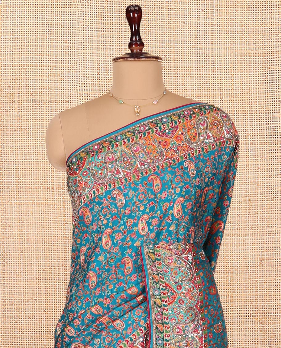 Blue Dola Silk Saree, Opulently Embellished with Colorful Floral-Paisley Design on Its Body, Highlighted by Print and Embroidery Border, Colorfully Decked Up Pallu, and Paired with a Contrast Blouse