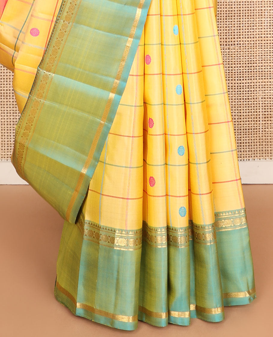 Yellow chakra butta enclosed checks kanchipuram silksaree, contrast rettai pettu ganga jamuna border of rekku,banaras,muthu & poun & chakra pallu