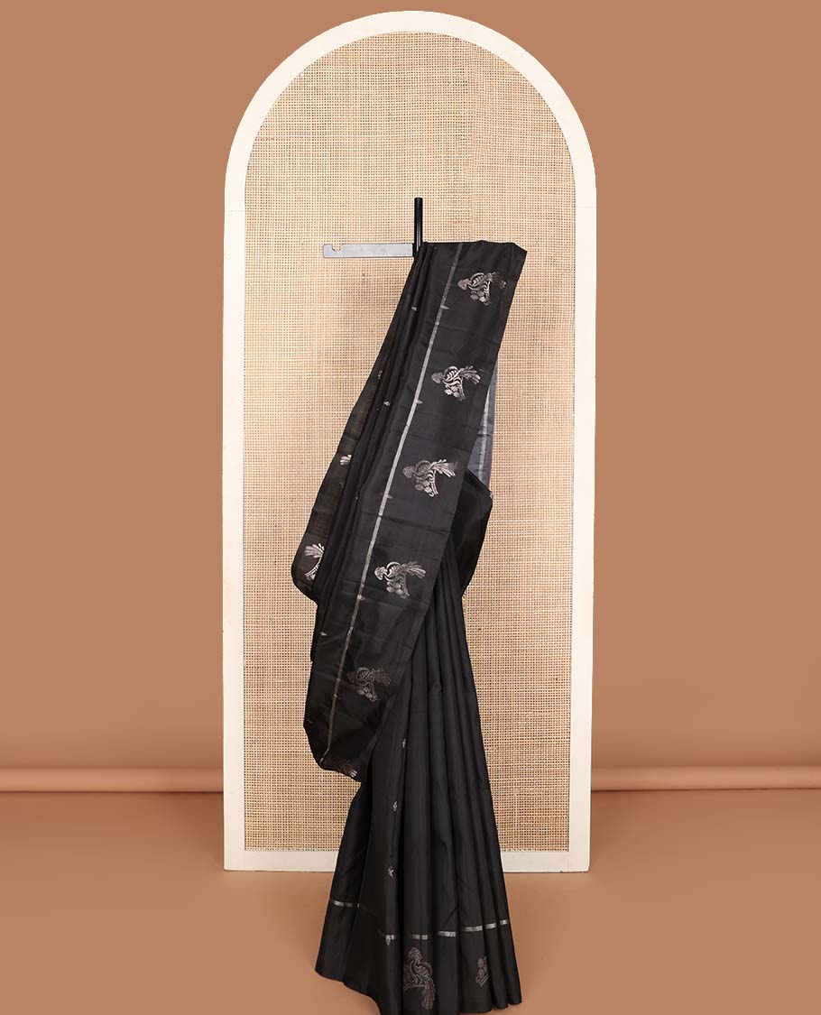 Black zari buttas Kanchipuram silk saree, zari mayil motifs woven border, and pallu features kodi mayil, yaanai and yaali motifs