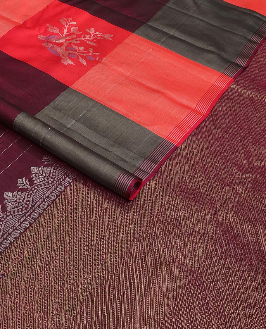 Multi-colored bird buttas enclosed checked Kanchipuram silk saree, striped piping border, and zari-rich pallu