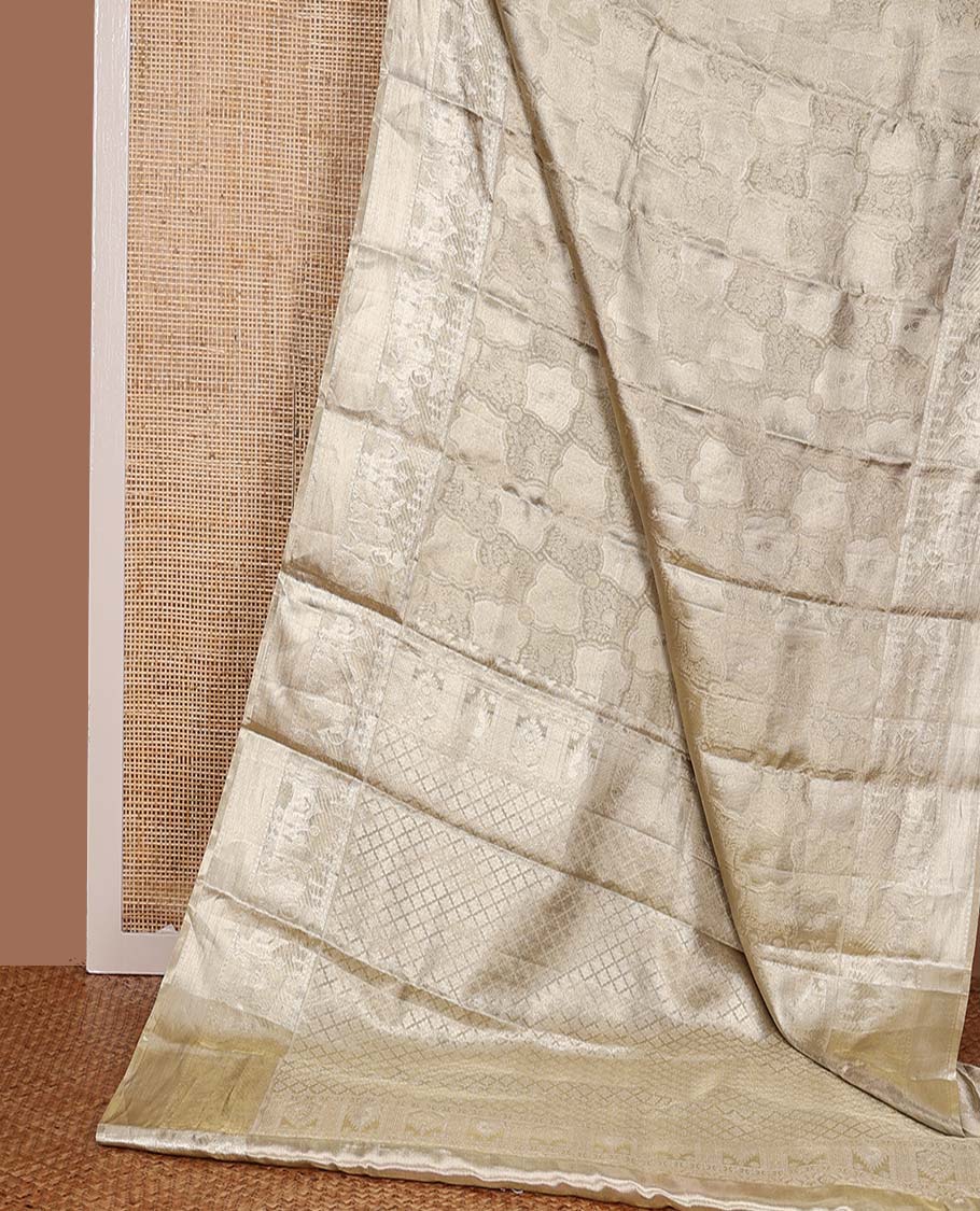 Gold jacquard Kanchipuram silk saree, wedding-theme border, and jaal pallu