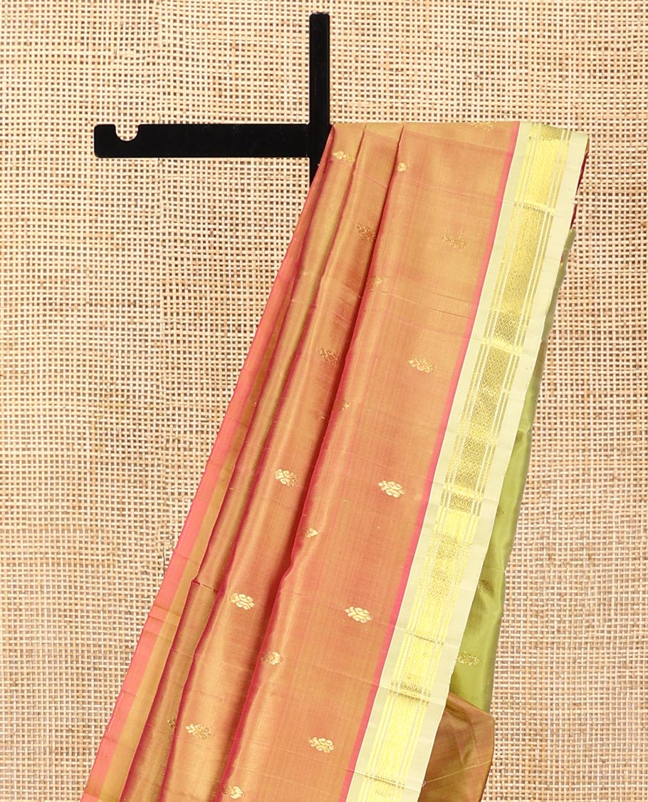 Orange Kanchipuram Silk Saree, Detailed with Zari Buttas All Over Its Body, Complemented by a Contrast One-Sided Border of Banaras, and Jaal Designs, Pallu of Zari Designs, and Comes Without a Blouse