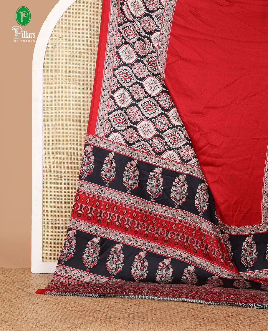 Red half-&-half style modal satin saree features floral & geometric design Ajrakh printed contrast border & pallu