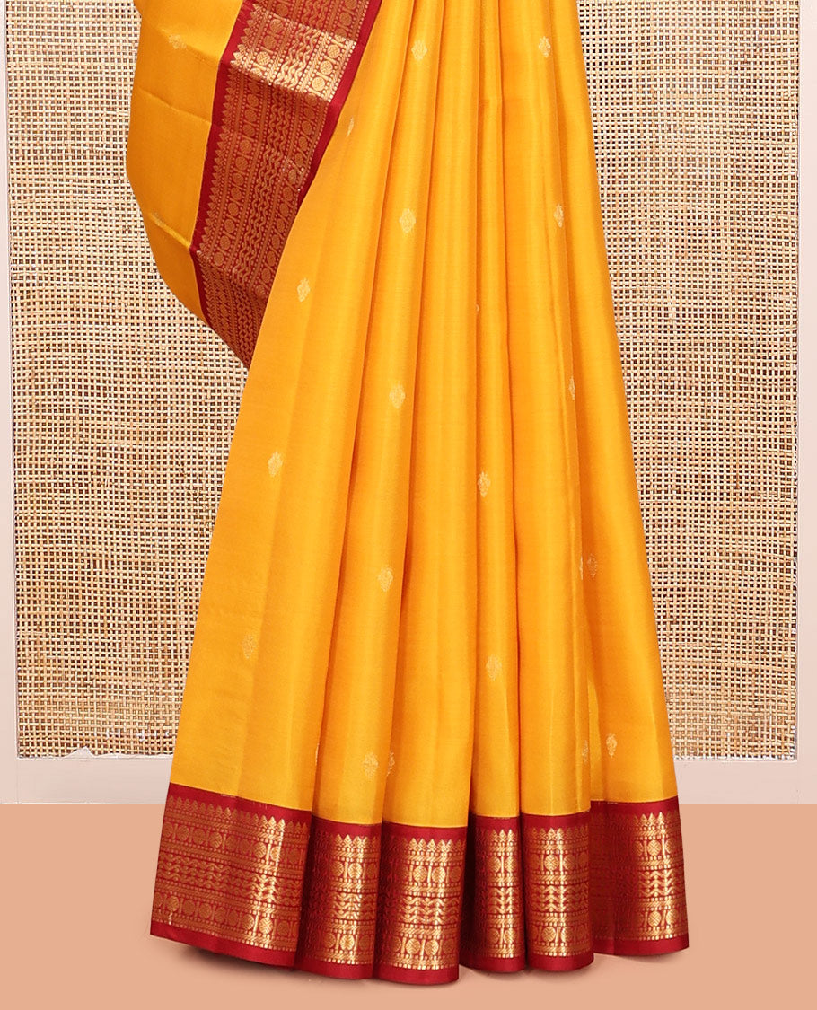 Yellow Vasundhara Lite Silk Mix Saree Features Zari Buttas, a Contrast Border of Thilakam Mokku, Muthu, Banaras, Rudraksham, and Neli Designs, Jaal Pallu, and a Contrast Blouse