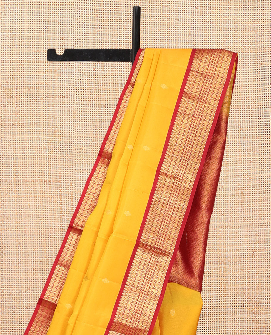 Yellow Vasundhara Lite Silk Mix Saree Features Zari Buttas, a Contrast Border of Thilakam Mokku, Muthu, Banaras, Rudraksham, and Neli Designs, Jaal Pallu, and a Contrast Blouse