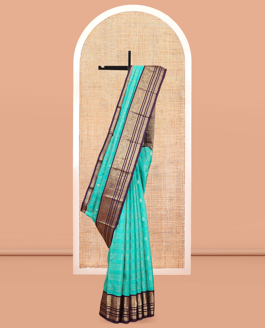 Turquoise Vasundhara Silk Saree, Accentuated with Zari Checks, a Contrast Border of Thilakam Mokku, Mayil, Neli, and Kamalam Designs, a Grand Jaal Pallu, and a Contrast Blouse