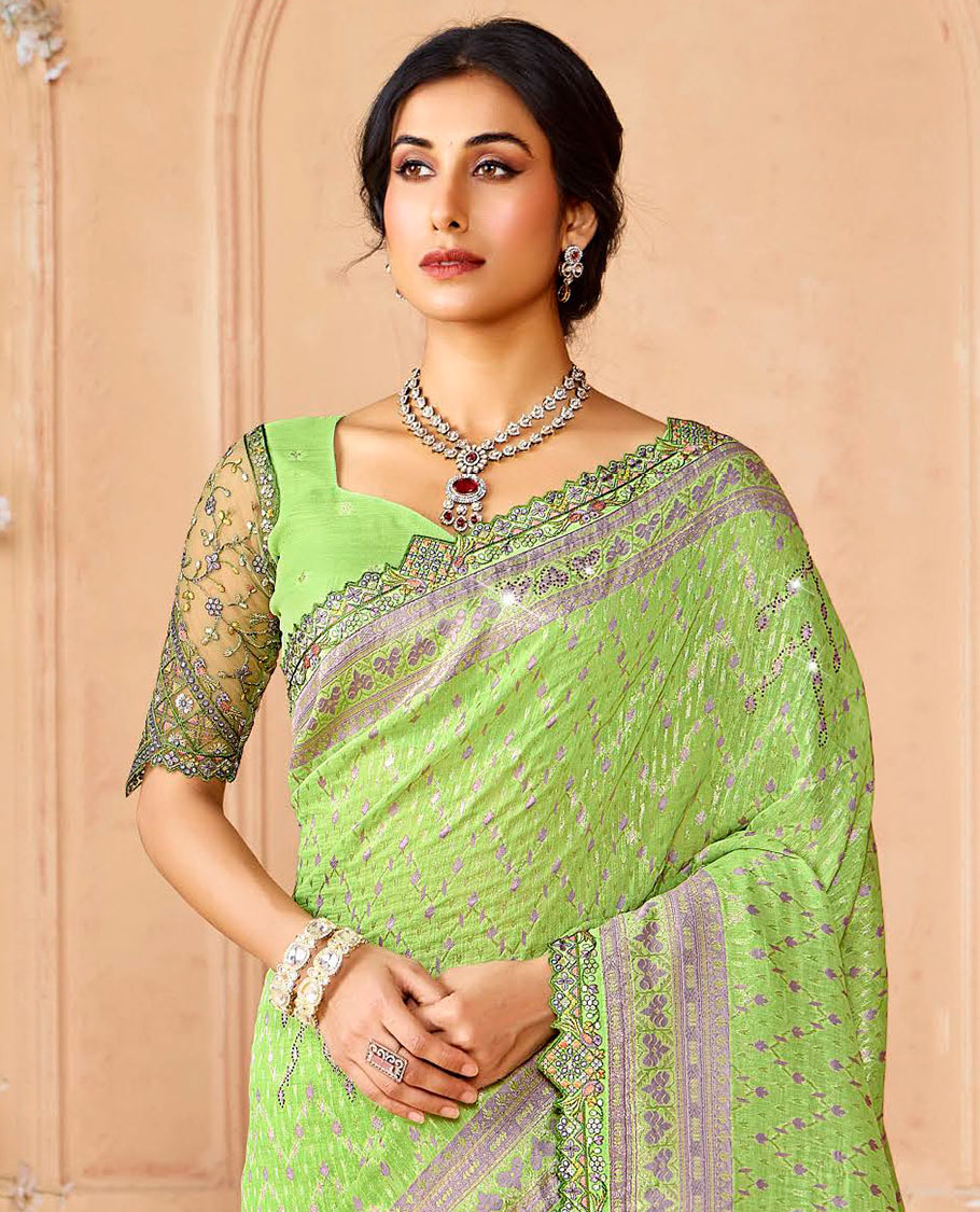 Green buttas and micro-stone work designer saree, scallop embroidered border, and pallu of intricate designs and stone work