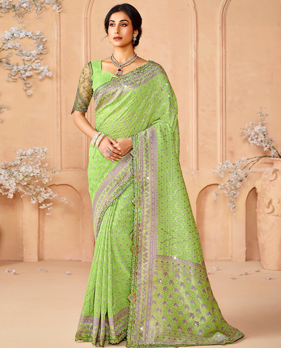 Green buttas and micro-stone work designer saree, scallop embroidered border, and pallu of intricate designs and stone work