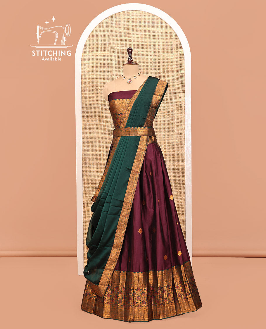 Maroon Art Silk Half Saree Features Buttas Steeped Skirt, Complemented by Contrast Traditional Border, Matching Blouse, and a Plain Zari-Bordered Dhavani