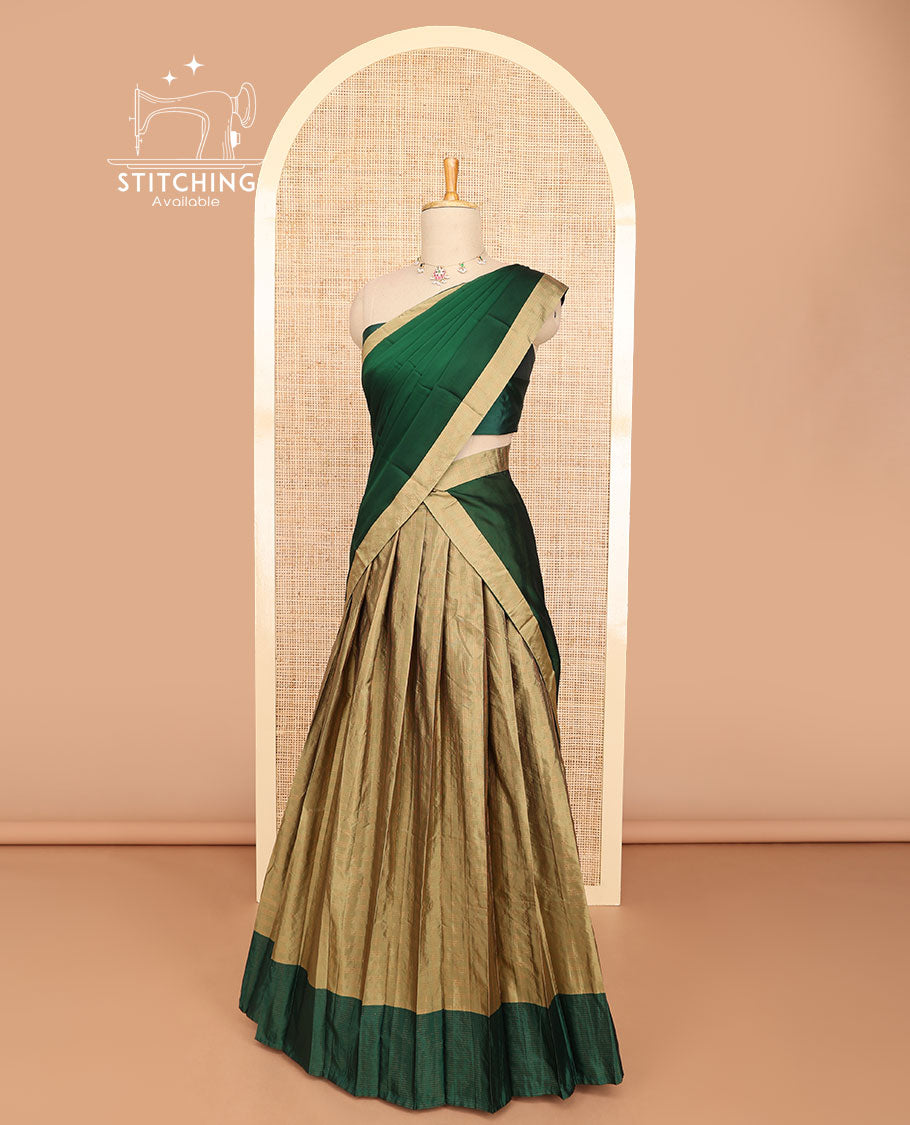 Pale brown striped half saree with contrast border, plain blouse & plain, checked border dhavani