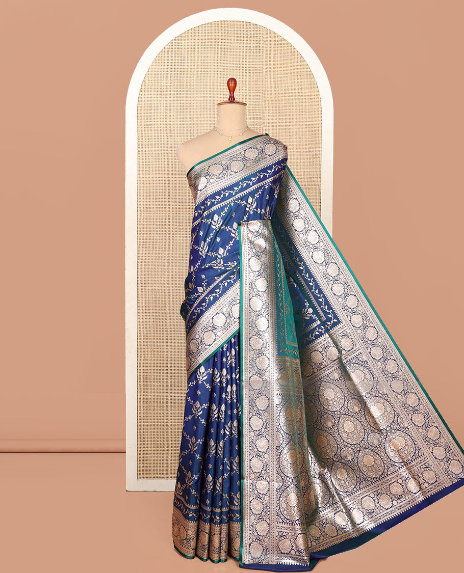 Blue Semi-Banaras Saree, Gracefully Embellished with Jaal Jacquard on Its Body, Highlighted by a Floral Creeper Design Border, Intricately Designed Zari Pallu, and Paired with a Matching Blouse