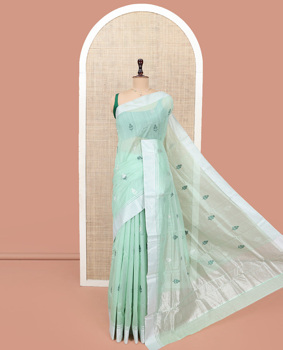 Green Chanderi Cotton Saree, Subtly Decked up with Floral Buttas All Over Its Body, Highlighted by a Bavanji Border, Pallu Steeped with Zari Stripes, and Paired with a Matching Blouse