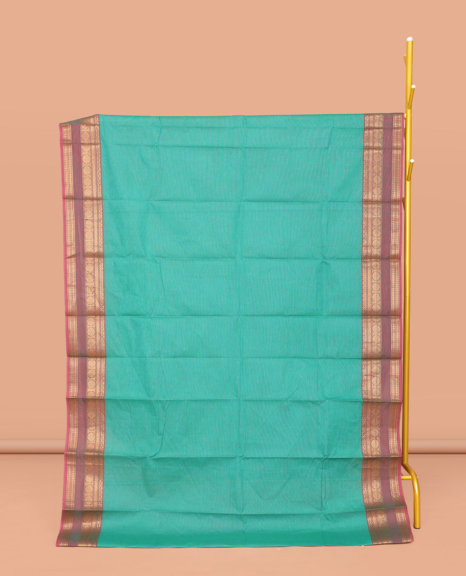Green Plain Chettinad Cotton Saree, Complemented by a Contrast Traditional Zari Design Border, Subtly Striped Pallu, and Paired with a Matching Blouse