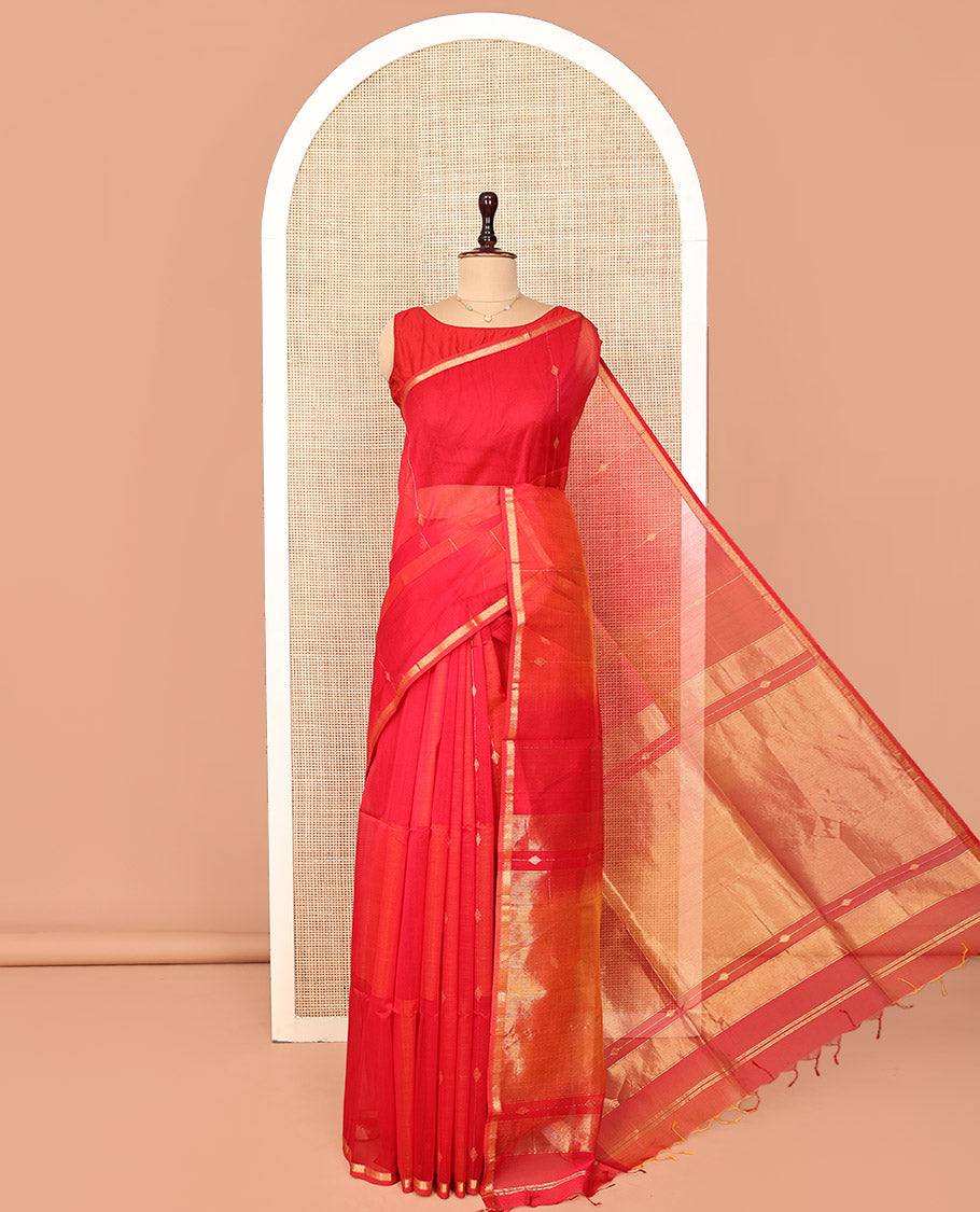 Red Maheshwari Cotton Saree, Uniquely Detailed with Diamond Buttas on Its Body, Highlighted by Piping Zari Design Border, Gleaming Pallu of Zari Stripes, and Paired with a Matching Blouse